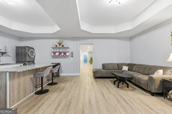 a view of kitchen island with furniture and wooden floor