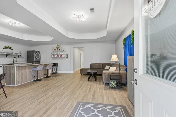 a bedroom with a flat screen tv and a bed