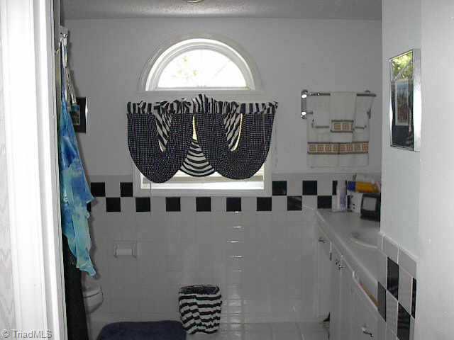 204 Vanzant Road Mocksville, NC 27028 - Photo 7 of 9 Other. Upstairs bath with tile flooring
