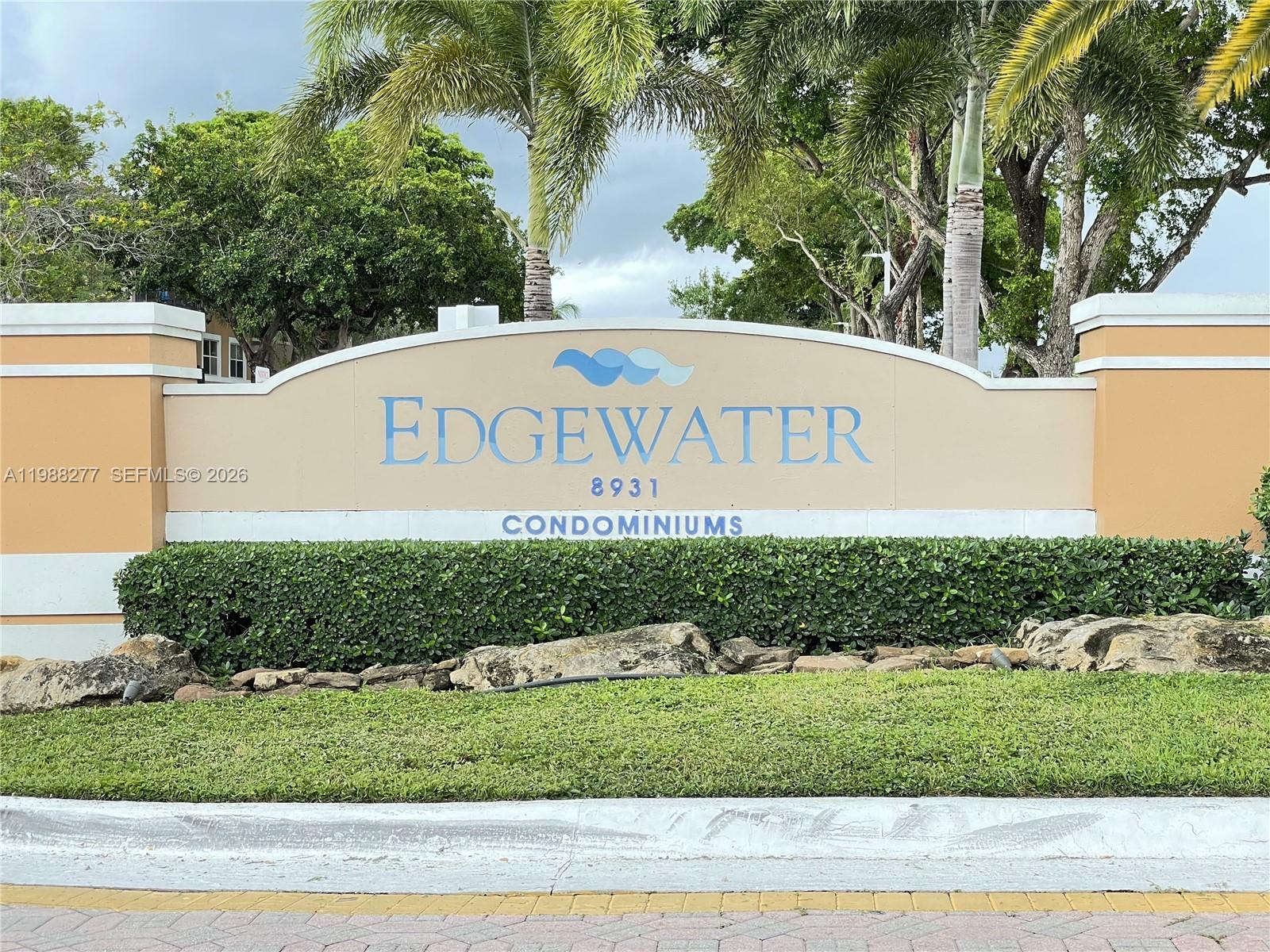 8871 Wiles Road, Unit 105 Coral Springs, FL 33067 - Photo 1 of 43 a sign that is on the side of a road