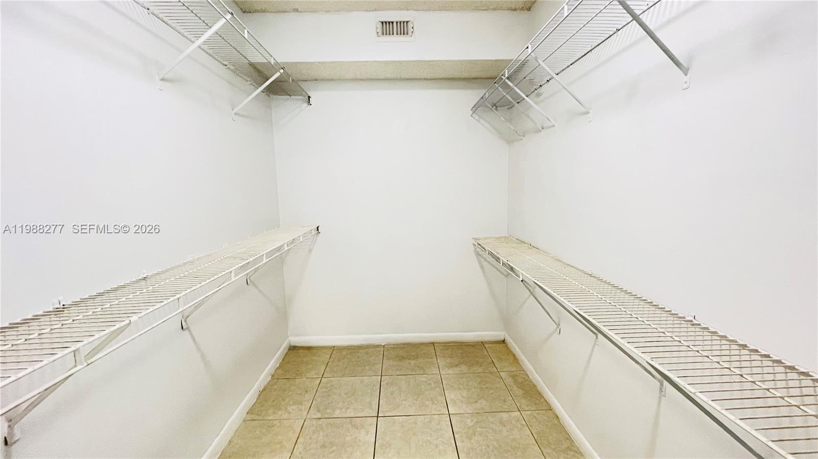 8871 Wiles Road, Unit 105 Coral Springs, FL 33067 - Photo 12 of 43 a view of a walk in closet