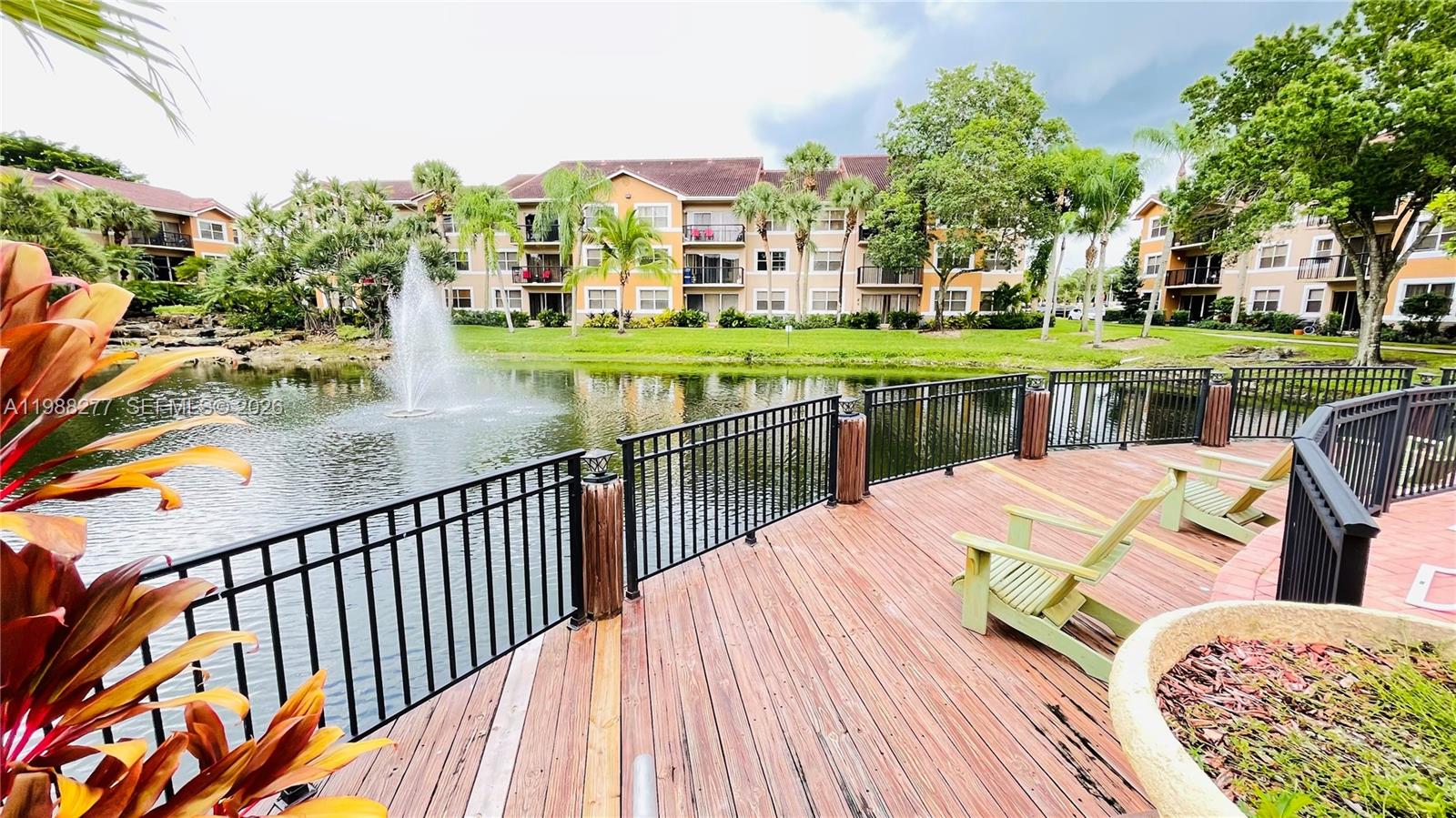 8871 Wiles Road, Unit 105 Coral Springs, FL 33067 - Photo 27 of 43 a balcony with an ocean view
