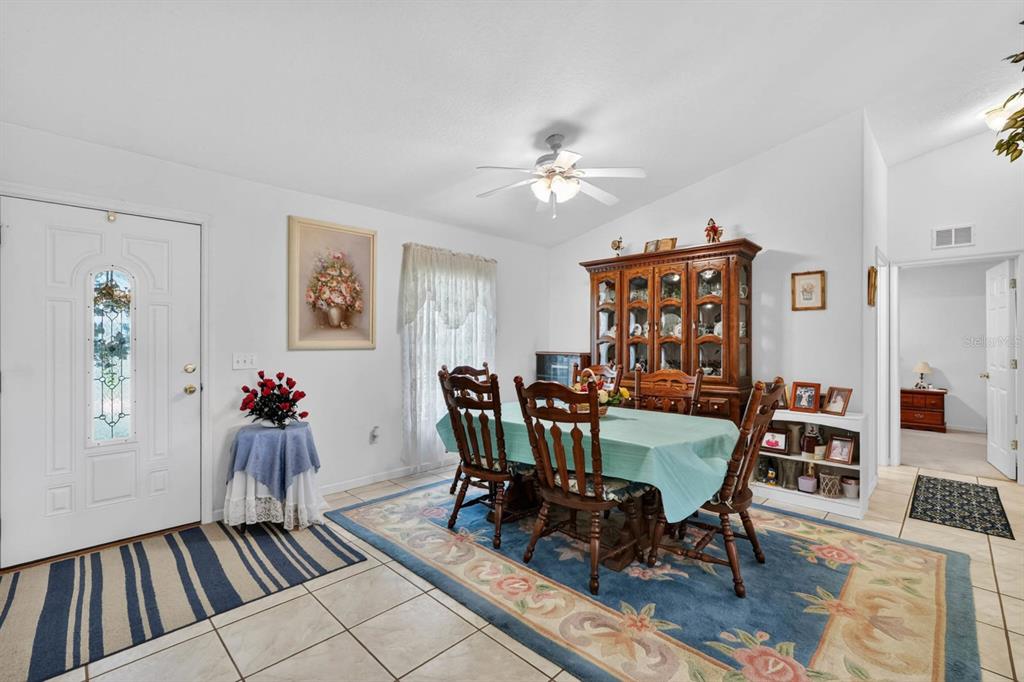 80 Roxboro Drive Palm Coast, FL 32164 - Photo 6 of 39 a view of a dining room with furniture window and wooden floor