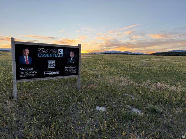 West N Altonah, UT 84002 - Photo 4 of 5 Expansive grassy landscape framed by distant mountains under a dramatic sky