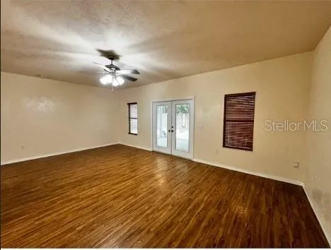 wooden floor in an empty room with a window