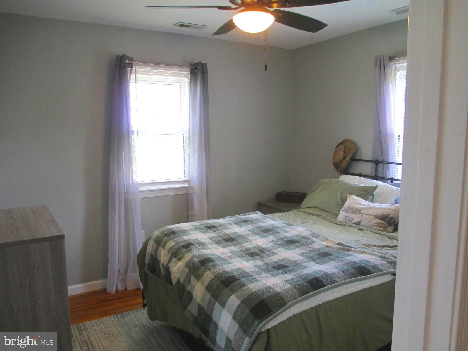 25241 Porters Grove Road Worton, MD 21678 - Photo 18 of 22 a bedroom with a bed and window