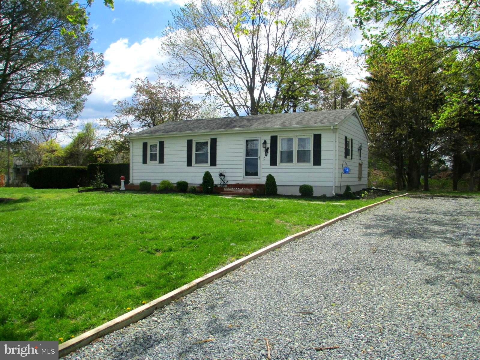 25241 Porters Grove Road Worton, MD 21678 - Photo 22 of 22 a front view of house with yard and green space