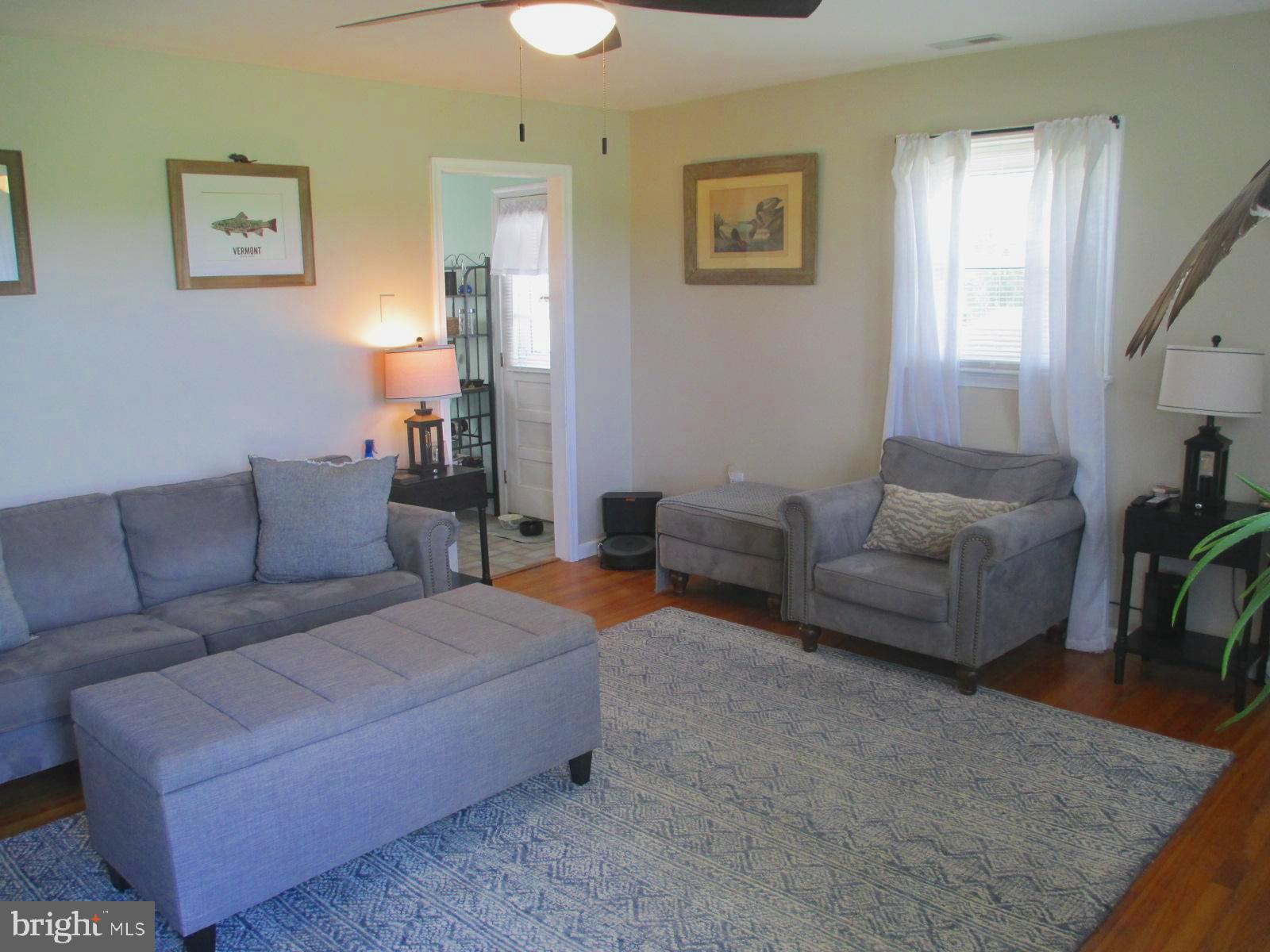 25241 Porters Grove Road Worton, MD 21678 - Photo 6 of 22 a living room with furniture and a couch