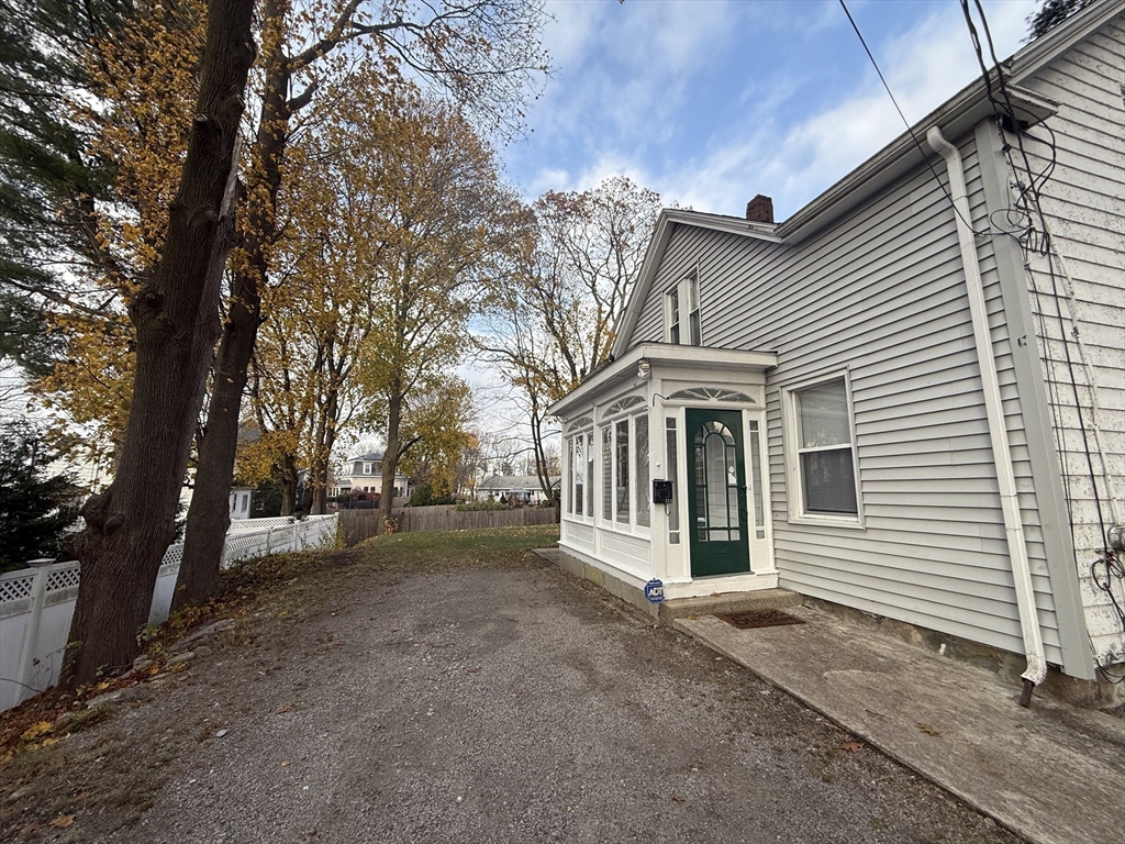 314 Webster Street, Unit B Needham, MA 02494 - Photo 2 of 14 a view of a white house with a large windows