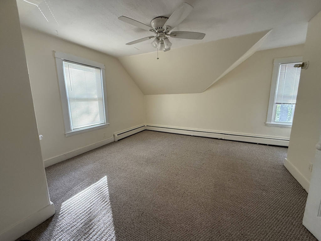 314 Webster Street, Unit B Needham, MA 02494 - Photo 10 of 14 a view of a livingroom with a ceiling fan and window