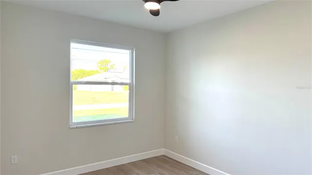 a view of an empty room with a window