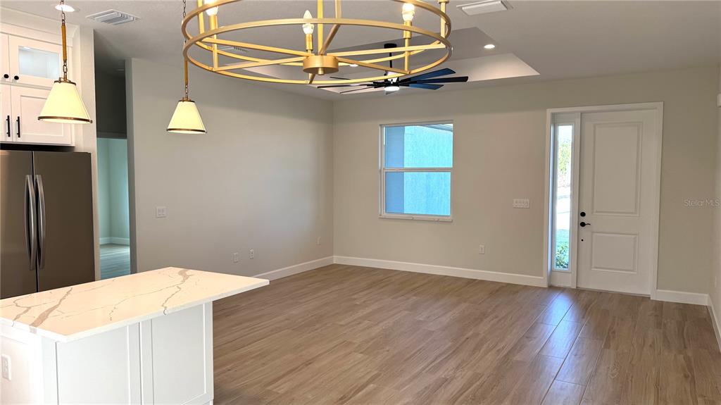 4884 Kisla Rd Port North Port, FL 34288 - Photo 15 of 19 a workspace with wooden floor