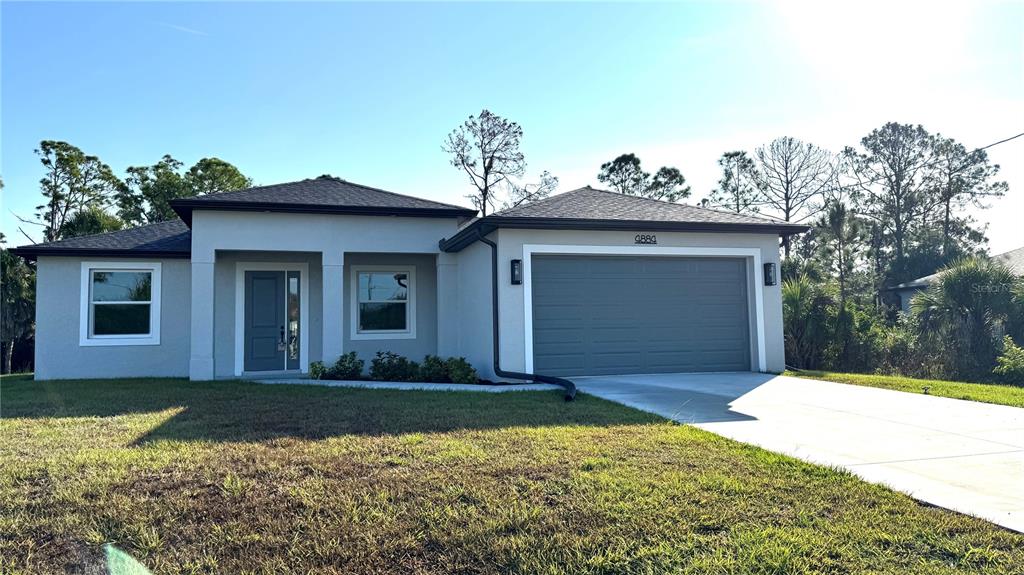 4884 Kisla Rd Port North Port, FL 34288 - Photo 19 of 19 a front view of a house with a yard