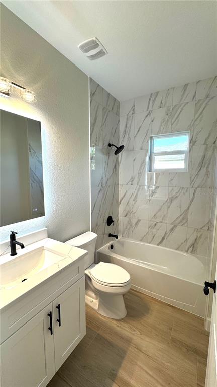 4884 Kisla Rd Port North Port, FL 34288 - Photo 9 of 19 a bathroom with a sink a toilet and a bathtub