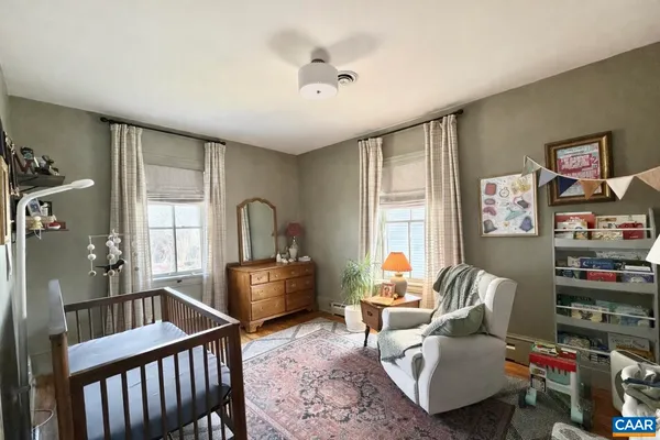 a bedroom with furniture and a window