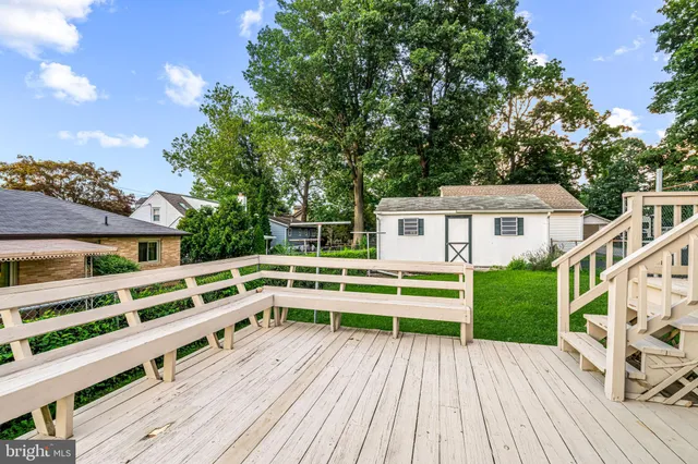 a view of a chair and tables in the balcony