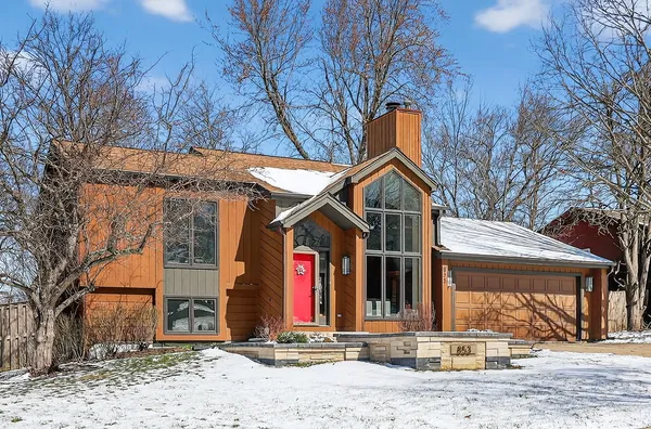 a view of a house with snow on the wall