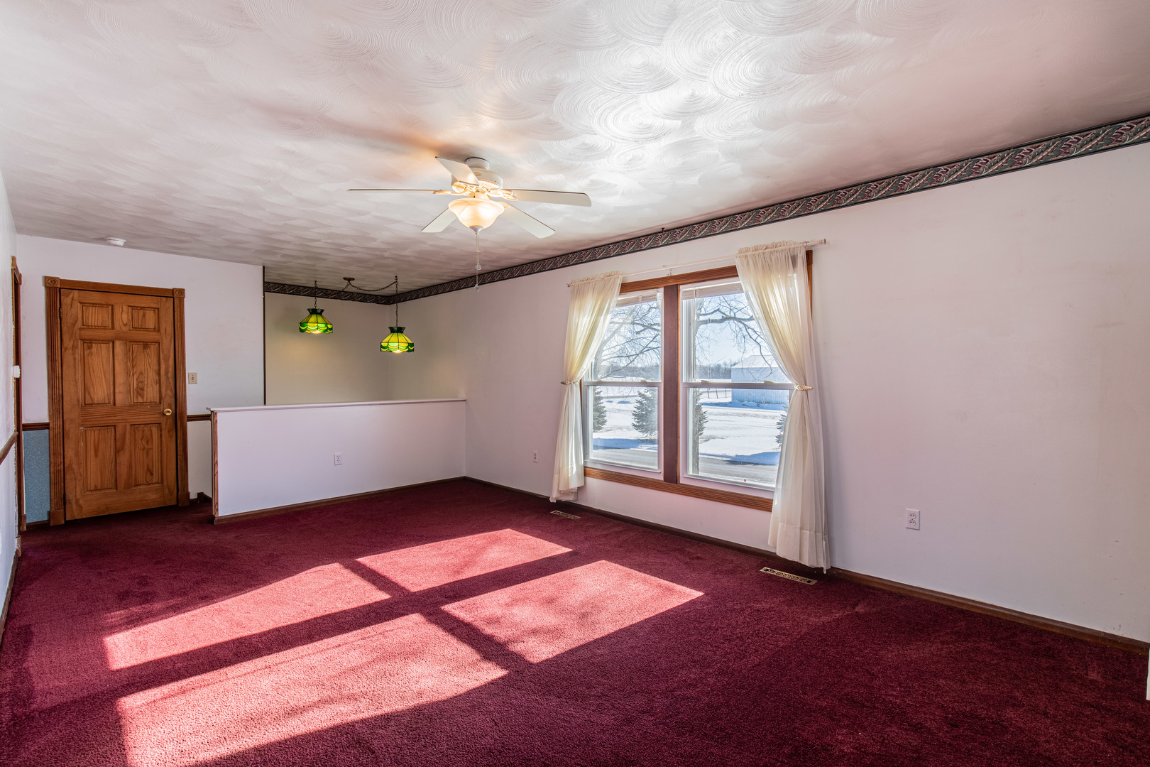405 Depot Street Walnut, IL 61376 - Photo 5 of 20 an empty room with windows