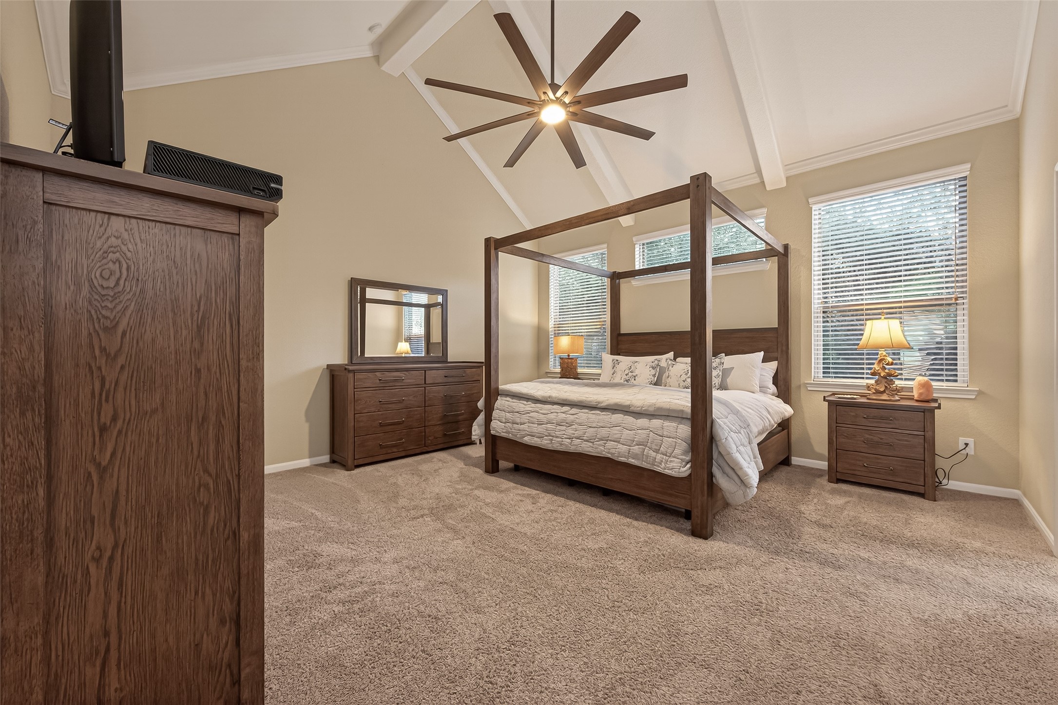 10 Ruchill Circle Conroe, TX 77304 - Photo 3 of 47 Over-sized Primary room, with Gorgeous Vaulted ceilings, and tons of natural light. Located on First Floor, making 2 bedrooms downstairs.