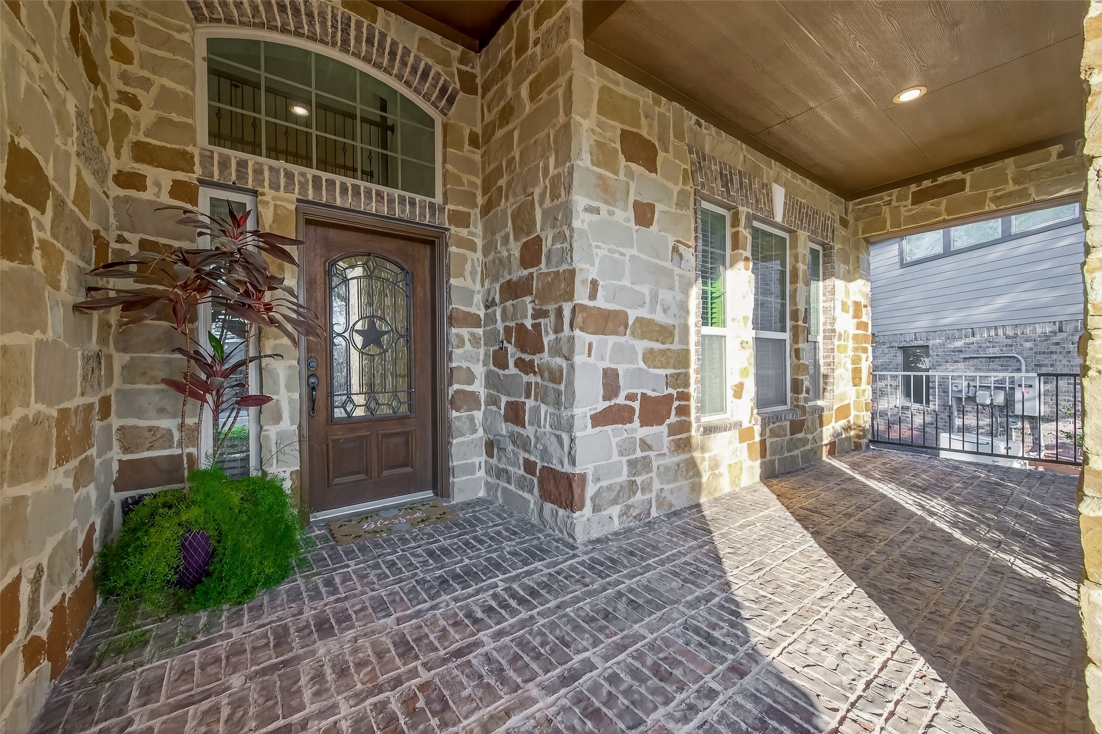 10 Ruchill Circle Conroe, TX 77304 - Photo 6 of 47 Brick Porch with Stone walls. So Welcoming and just waiting for a couple of rocking chairs.