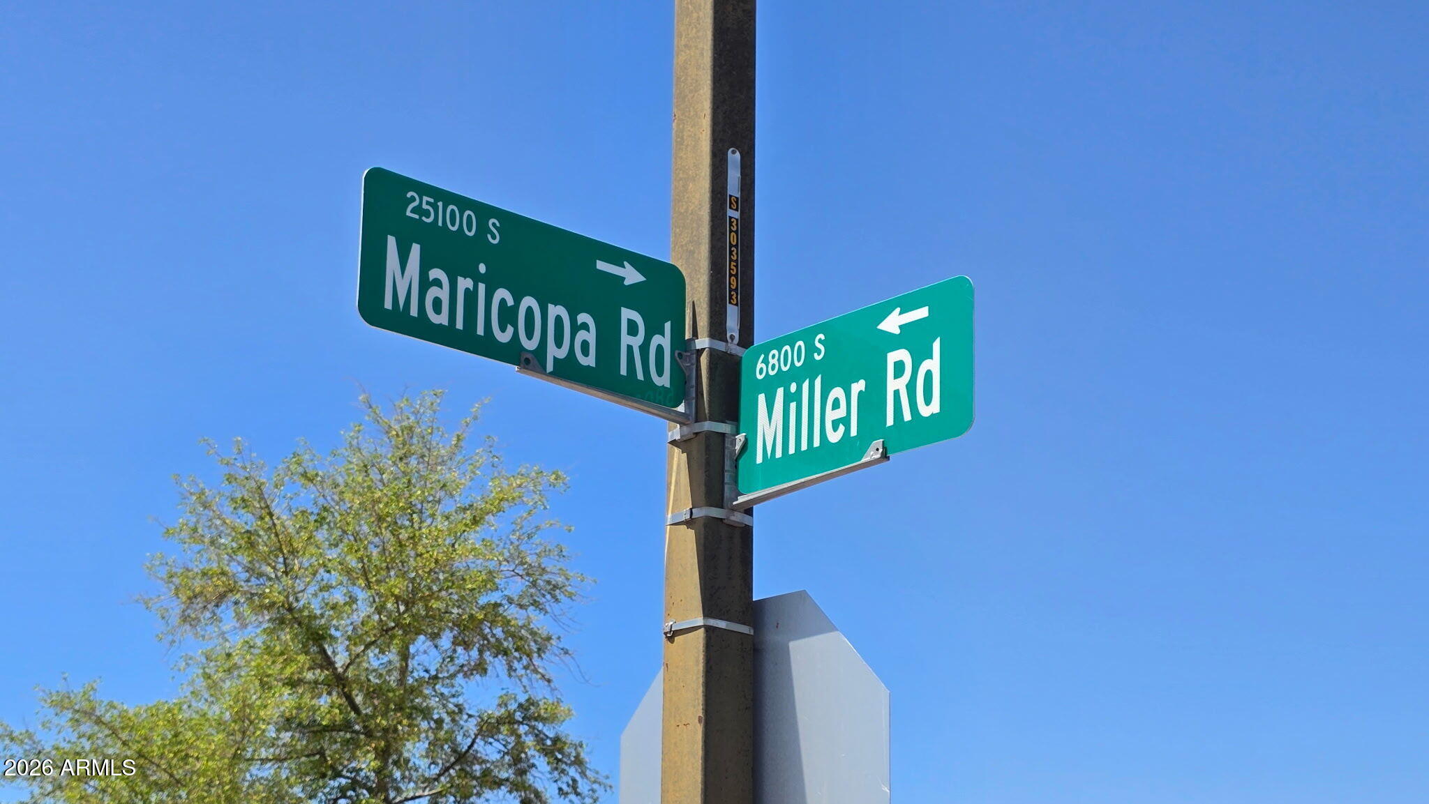 6803 South Miller Road Buckeye, AZ 85326 - Photo 39 of 50 a street sign on a pole