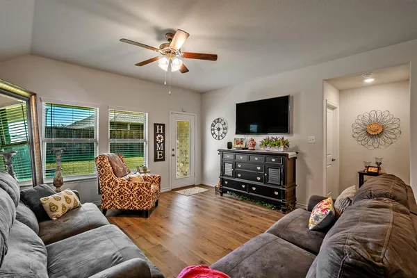 a kitchen with stainless steel appliances granite countertop a stove a refrigerator and a microwave