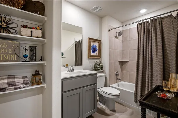 a bathroom with a shower and a sink