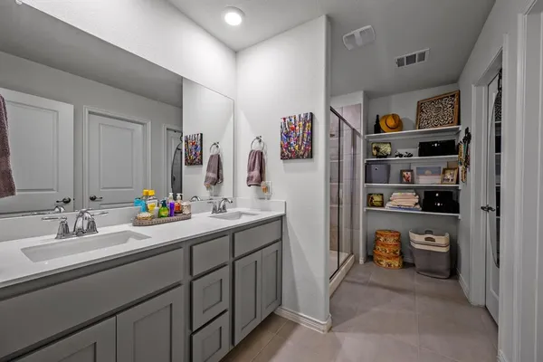 a bed room with a bed and a chandelier