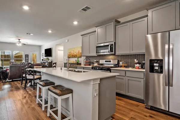 a front view of a building with a garden