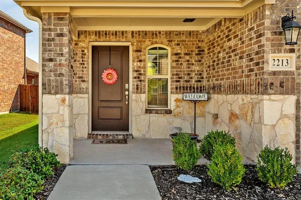a view of a big yard with large trees and a big yard with table and chairs
