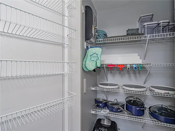 a kitchen with cabinets appliances a sink and a counter top