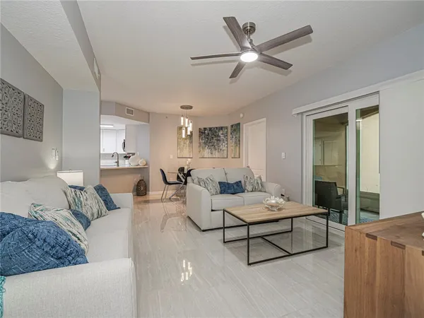 a living room with furniture and white walls