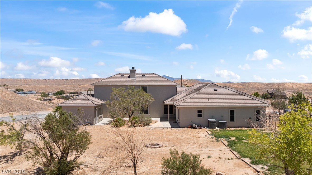 575 Gann Avenue Logandale, NV 89021 - Photo 64 of 75 A spacious desert home offers expansive mountain views and a private, undeveloped lot.
