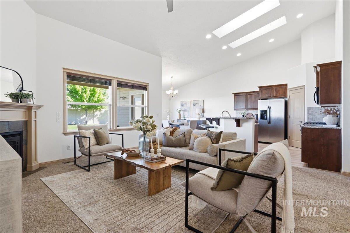1183 North Buffalo Way Middleton, ID 83644 - Photo 6 of 47 Vaulted ceilings featuring two skylights and recessed lighting enhance this living area