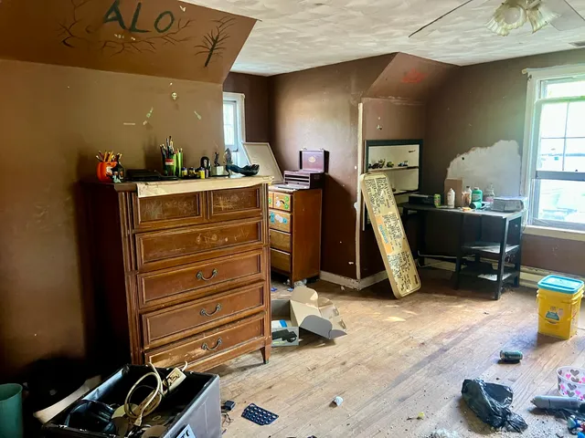 a bed room with a bed and a window