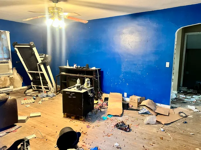 a view of a workspace with furniture and gym equipment