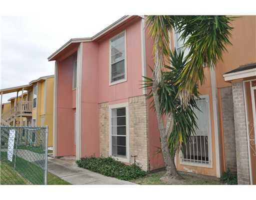 a front view of house with small garden
