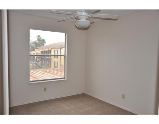 6702 Everhart Road, Unit 104W Corpus Christi, TX 78413 - Photo 9 of 10 a view of an empty room with a window