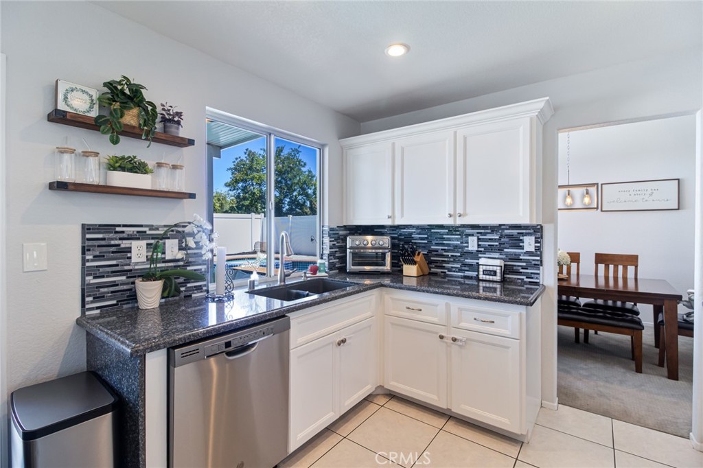 32182 Cala Torrente Temecula, CA 92592 - Photo 13 of 35 a kitchen with a sink cabinets and window