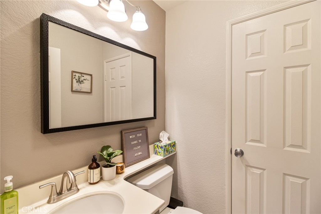 32182 Cala Torrente Temecula, CA 92592 - Photo 17 of 35 a bathroom with a sink and a mirror
