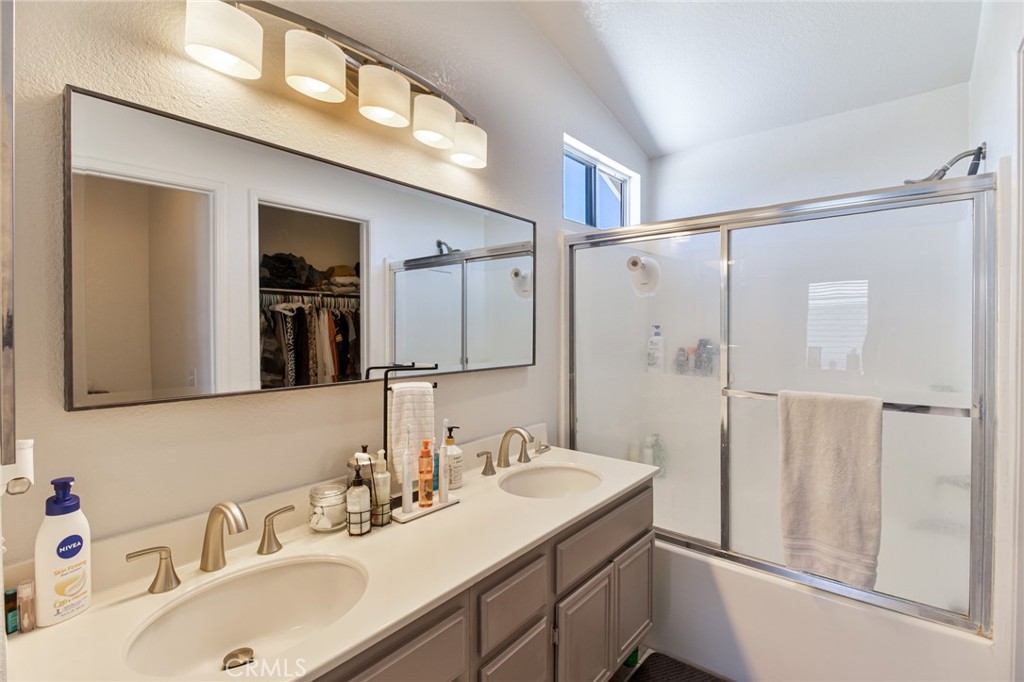 32182 Cala Torrente Temecula, CA 92592 - Photo 19 of 35 a bathroom with a sink double vanity and a mirror