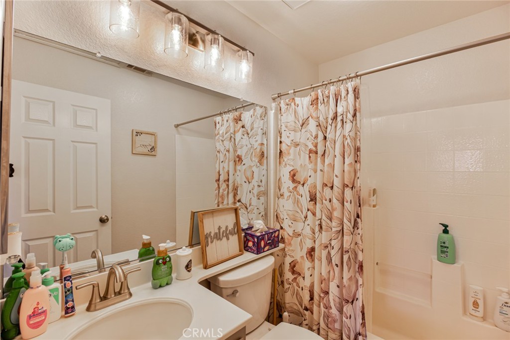 32182 Cala Torrente Temecula, CA 92592 - Photo 22 of 35 a bathroom with a sink toilet and shower