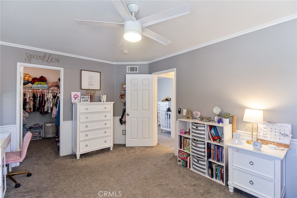 32182 Cala Torrente Temecula, CA 92592 - Photo 24 of 35 a view of a bedroom with workspace and windows