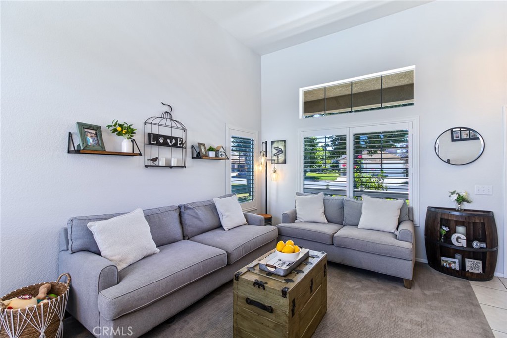 32182 Cala Torrente Temecula, CA 92592 - Photo 7 of 35 a living room with furniture and a flat screen tv