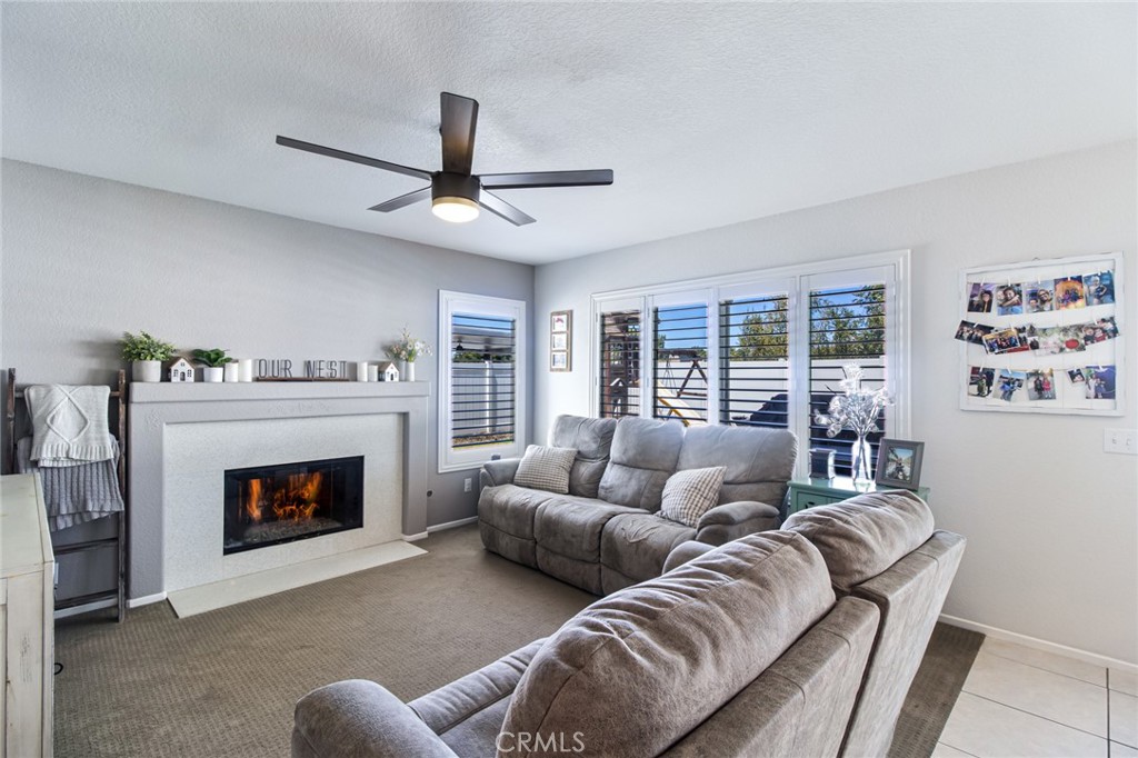32182 Cala Torrente Temecula, CA 92592 - Photo 9 of 35 a living room with furniture and a fireplace