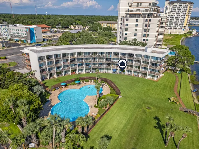 an aerial view of a house with a swimming pool