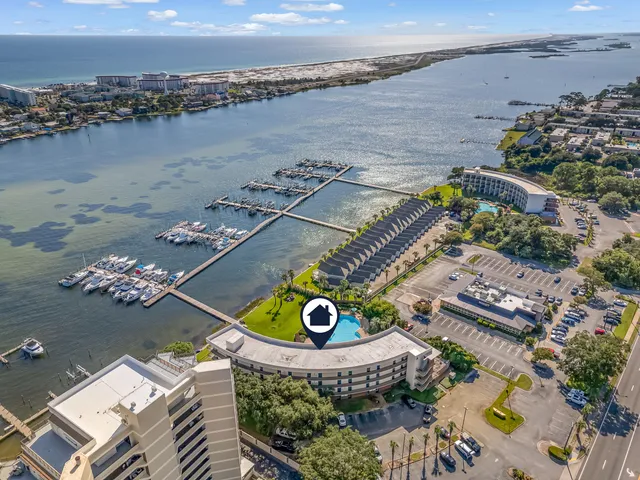 an aerial view of a house with a ocean view
