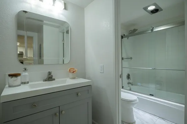 a outdoor living area with furniture and a potted plant