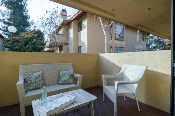 a view of a chairs and table in a terrace