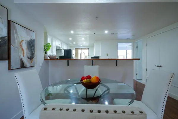 a kitchen with stainless steel appliances granite countertop a sink and a stove